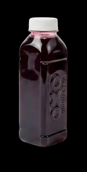 Bottle of OXO tea concentrate, dark purple